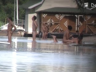 Naked People Are Having Some Good Time On The Beach