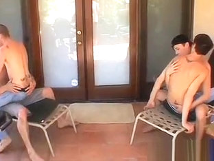 Horny twink sucking and licking three hard big dicks