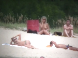 Busty blonde nude beach MILF spied on by a voyeur