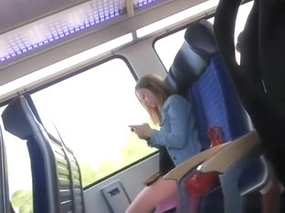 Guy wanks his cock in train next to girl