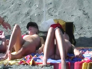 Wet nudist sunbathing her body