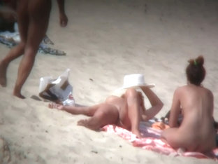 Mature Blonde Spreading Her Shaved Pussy On The Beach