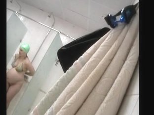 Pregnant woman with natural melons in the shower