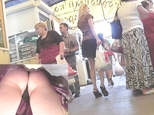 Legs and smooth butt upskirt at the market