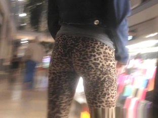 Teen in leopard leggings at the shopping mall