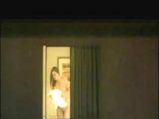 Neighbor spied topless in her bedroom