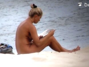 Lovely Philander Reading A Newspaper On Nudist Beach