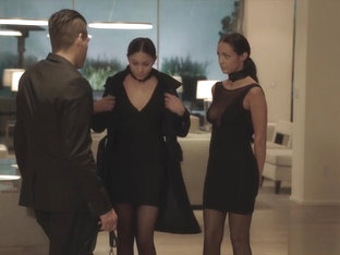 Two slaves on leashes squirm on a giant cock