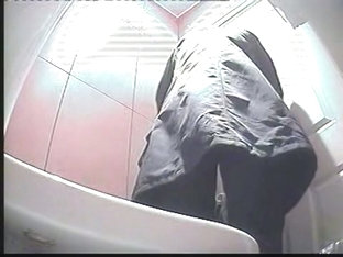 A MILF Pissing In The Toilent To A Voyeur Spy Cam