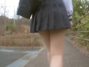 Sexy schoolgirl upskirt sitting on the park bench view