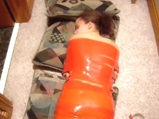 Young Brunette Laying On The Floor Wrapped In Red Tape