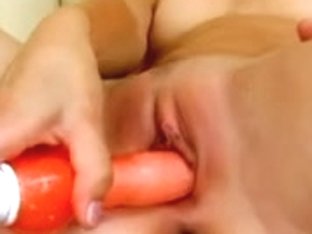 Margareth with an orange fake penis