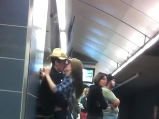 Making out in the subway station