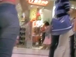 Sexy Girl Walking Around A Mall With A Voyeur Cam Following