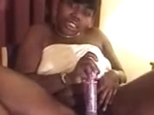 Chocolate Hood Babe Plays With Soaked Twat With Fake Penis.