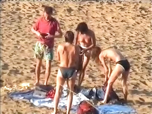 Nudist family leaving the beach