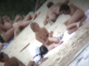 Tiny boobs exposed on the beach for hidden cam voyeur video