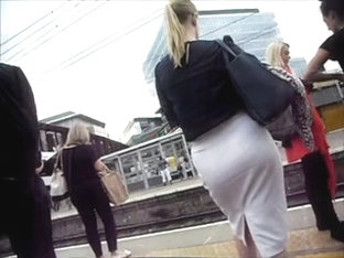 Gorgeous blonde with big round ass in tight white skirt