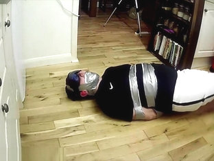 Footballer tied and taped tight on kitchen floor ALTERNATIVE VIEW