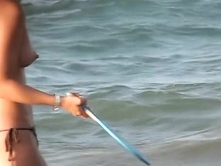 Voyeur Films Babes With Naked Tits Playing On The Beach