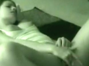 home movie scene from a cutie masturbating during the time that this babe watches porn on tv