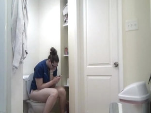 Chubby girl in glasses taking a long pee