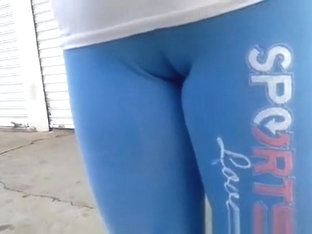 Woman in tight blue sports pants big cameltoe