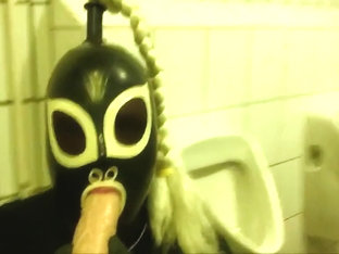 Rubberdoll Monique - Blowjob training in a public toilet