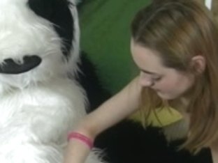 sucks teddy bear with a pink fake penis