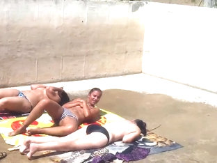 Three Caught Topless Sunbathing
