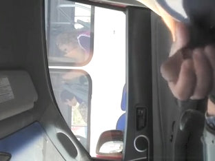 Guy strokes his cock in traffic next to woman in bus