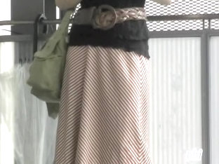 Asian Babe Has Her Long Skirt Torn By A Street Sharker.