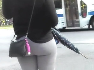 Girl wearing gray leggings has nice round ass