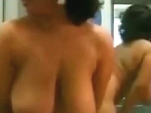 Very Big Breasted Woman Shows Her Curly Cunt In Front Of A Mirror