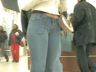 Sexy Latina girl in jeans followed by voyeur