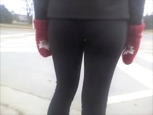 Candid street booty wrapped into tight pants on a cool day