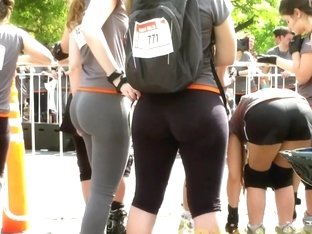 Sports Girls In Tight Pants Run Cross On The Street