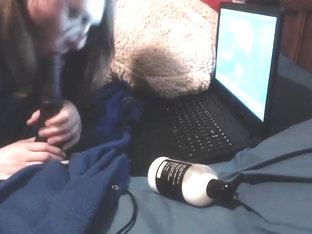 Nonbinary getting their face painted with cumlube