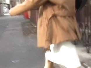 Asian babe got skirt sharking in front of her mailbox.