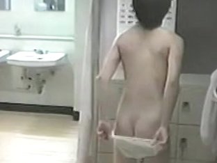 Asian wench wiping her booty after a good shower