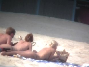 Thrilling Nude Friends Are Relaxing On A Nudist Beach