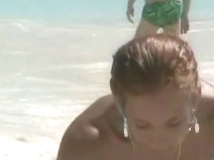 Candid beach camera captures alluring chick with great boobs