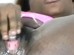 Dark-skinned diva gets her pussy wet and squirty