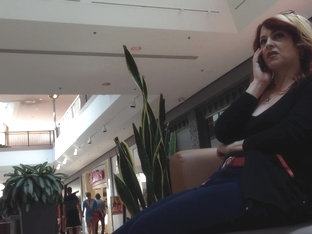 Mature woman sitting on mall bench