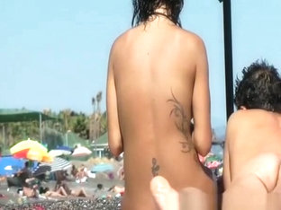 Tattooed nudist woman spied beach