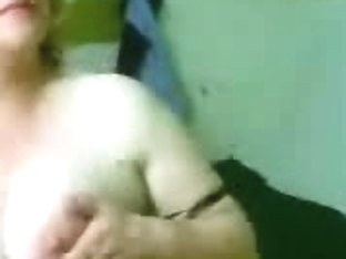 Mature bares her boobs