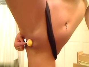 Dirty brunette masturbates with lolipop