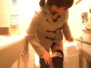 Asian Woman Caught In Public Toilet Peeing