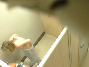 Cute blonde and a chubster on hidden cam in the changing room