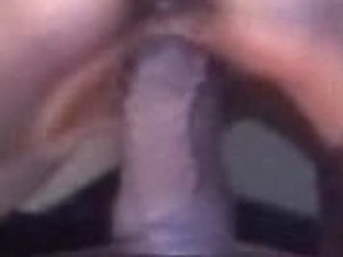 Black Dildo Dips Deeply In The Chershed Female Hole